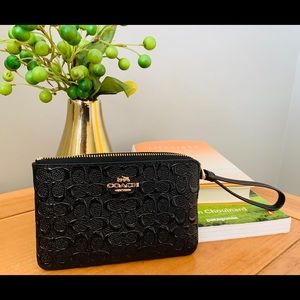 NWT Coach patent leather wristlet. New with tags.